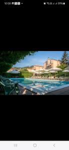 a picture of a swimming pool with blue water at Holiday Gufetto in Pietra Ligure