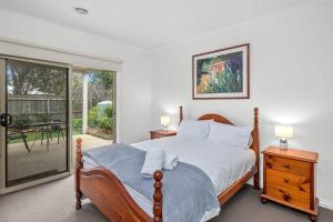 Ένα ή περισσότερα κρεβάτια σε δωμάτιο στο Stunning ocean views indoor spa and sun deck
