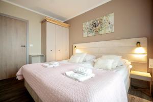 Posteľ alebo postele v izbe v ubytovaní BelMare by Baltic Home + 12 fotografií