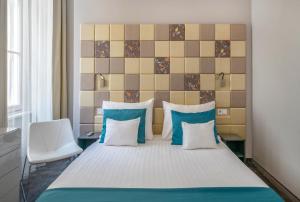 Postel nebo postele na pokoji v ubytování Hotel President