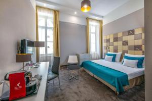 Postel nebo postele na pokoji v ubytování Hotel President
