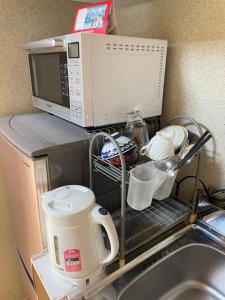 Oprema za pripravo čaja oz. kave v nastanitvi Unkai no Sato no Yado