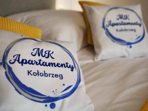 Posteľ alebo postele v izbe v ubytovaní MK Apartamenty Morski