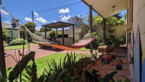 a hammock in the backyard of a house at Coastal Serenity Central Torquay in Torquay