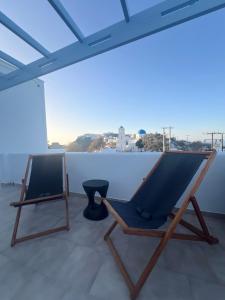 a hammock sitting on top of a roof at Villa Fotini in Firostefani