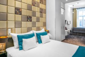 Postel nebo postele na pokoji v ubytování Hotel President
