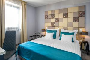 Postel nebo postele na pokoji v ubytování Hotel President