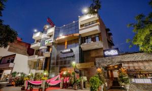 a building with a sign on the side of it at Treebo Bliss in Jaipur