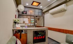 a bar in a room with a sign that says home bliss at Treebo Bliss in Jaipur