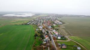 an aerial view of a town in the middle of a field at Ostseeperle Börgerende in Börgerende-Rethwisch