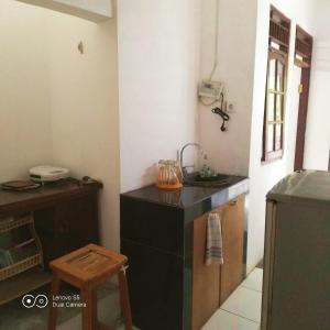 a kitchen with a sink and a counter top at PM Room in Jakarta