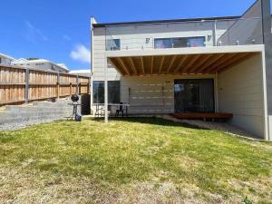 a house with a lawn in front of it at 3 bedroom Apartment at Kingston in Kingston