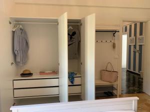 a walk in closet with white walls and white cabinets at SpazioSanta in Santa Margherita Ligure