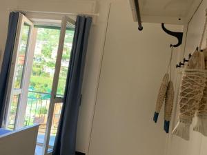 a room with a glass door and a window at SpazioSanta in Santa Margherita Ligure