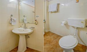 a bathroom with a toilet and a sink at Treebo Bliss in Jaipur