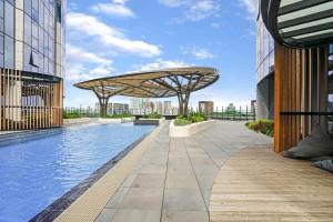 a swimming pool on the roof of a building at Breathtaking Views 49th floor - Melbourne Square in Melbourne