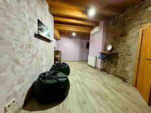 a room with two black bags on the floor at La casa de Claverol in Claverol
