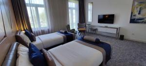 TV a/nebo společenská místnost v ubytování Hotel Austria & Bosna