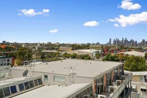 an overhead view of a city with a building at A River-side 2bdm Footscray Oasis + Parking in Melbourne