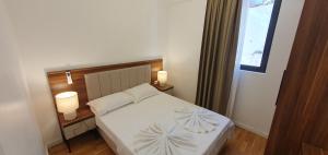 Postel nebo postele na pokoji v ubytování Apartmani Jovanovic - Rafailovici