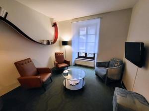 Et tv og/eller underholdning på Appartement avec terrasse