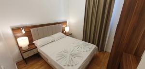 Postel nebo postele na pokoji v ubytování Apartmani Jovanovic - Rafailovici