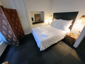 En eller flere senge i et værelse på Appartement avec terrasse