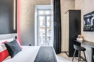a bedroom with a bed and a window at Gallery Experience Napoli in Naples