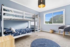 a bedroom with two bunk beds and a window at Premiere Seaside Home - Relaxing Family Getaway* in Rye