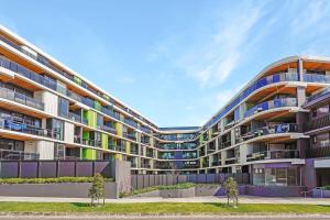 an apartment building with balconies on the side of it at Cozy Nest in Prime Hawthorn w parking & pool in Melbourne