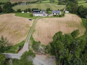 an aerial view of a farm with a house and a road at Deerpark Holiday Cottage (1) in Killaloe