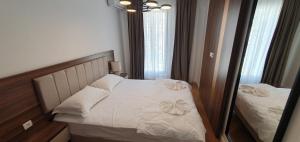 Postel nebo postele na pokoji v ubytování Apartmani Jovanovic - Rafailovici