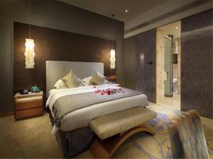 En eller flere senge i et værelse på Yunkai Hotel
