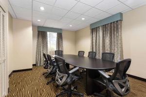 a conference room with a table and chairs at La Quinta by Wyndham Bonita Springs Naples North in Bonita Springs