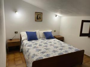 Ένα ή περισσότερα κρεβάτια σε δωμάτιο στο Villino Il Lentischio