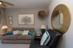 A seating area at Los Olivos 13 - One Bed