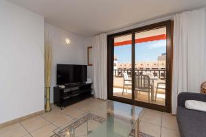 A television and/or entertainment centre at Parque Santiago I 242 - One Bed