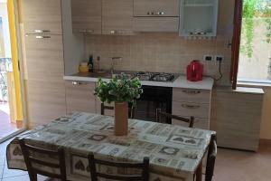 A kitchen or kitchenette at Borgo San Giorgio Apartment Még 6 kép