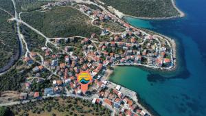 an aerial view of a small island in the water at Wave Sound Apartments - Village View in Skala Marion