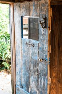 an old blue door with a sign on it at Swallowfield Glamping-Station Master in Yeovil