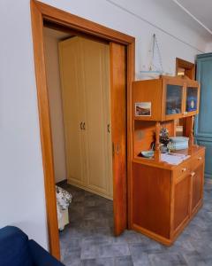 a room with a door open to a room with a cabinet at Appartamento La Follicara in Anacapri +23 photos