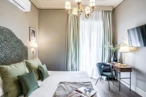 Un televizor și/sau centru de divertisment la Antica Residenza Del Corso