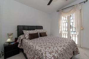 a bedroom with a large bed and a window at Villa Melua in Chayofa +53 photos