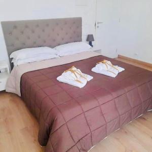 Ένα ή περισσότερα κρεβάτια σε δωμάτιο στο B&B La Maison del Borgo