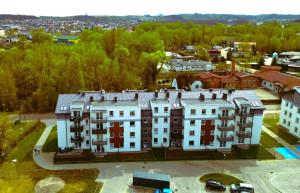 an aerial view of a building in a city at Slow River Apartment in Nowe Miasto Lubawskie