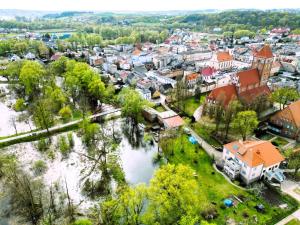 an aerial view of a town with a river at Slow River Apartment in Nowe Miasto Lubawskie