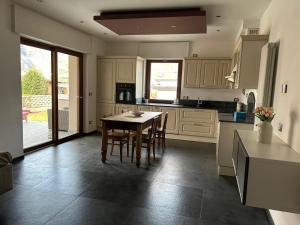 a kitchen with a table and chairs in it at Casa Dolce Casa in Masera