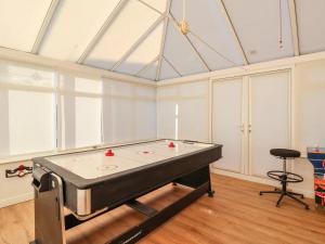 a pool table in a room with a ceiling at THE Beach House in Prestatyn