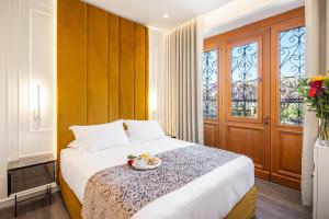 a bedroom with a bed with a plate on it at Bella Venezia in Corfu