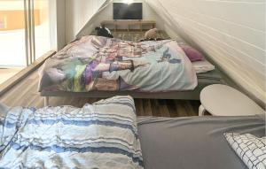 a room with two beds and a couch in it at Lovely Home In Frekhaug With Wifi in Alversund
